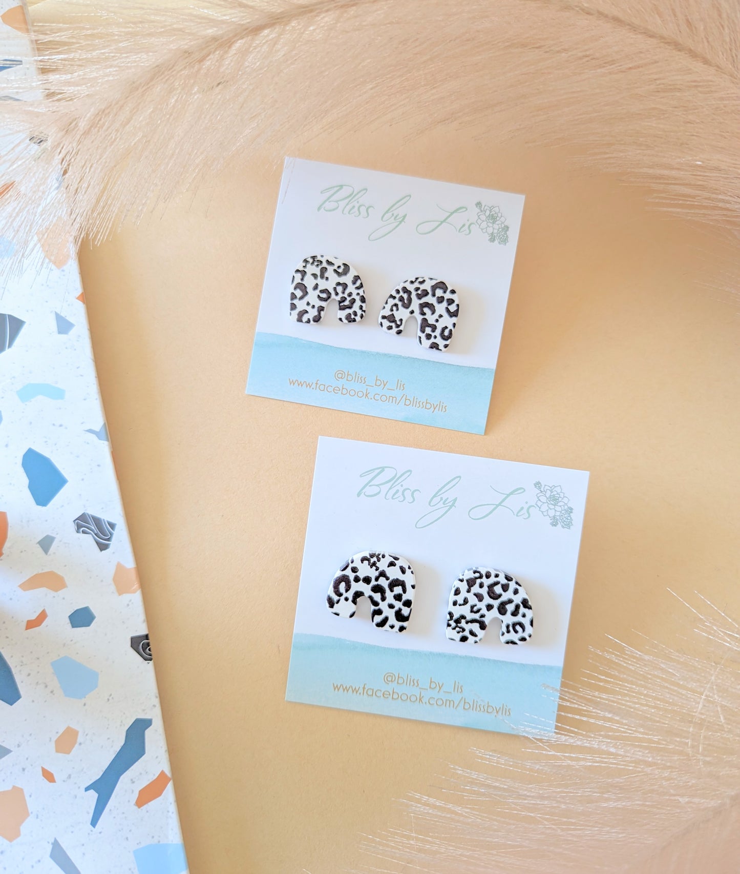 COW LEOPARD ARCH STUDS